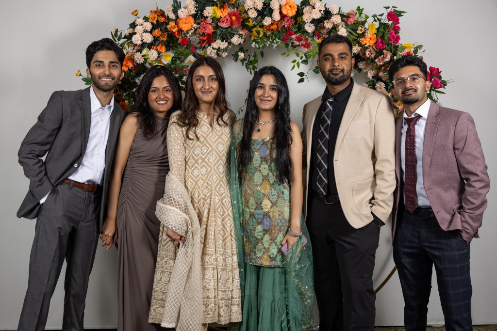 Group of guests posing together at a formal celebration in Mississauga
