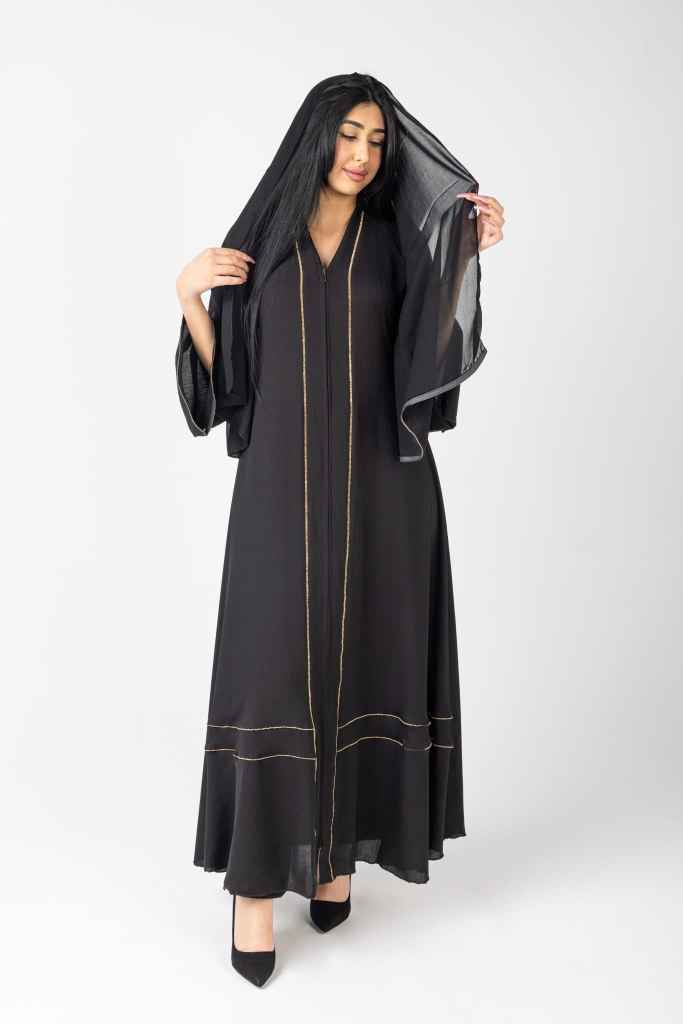 Fashion model posing in a long black dress during a studio fashion photography session in Mississauga